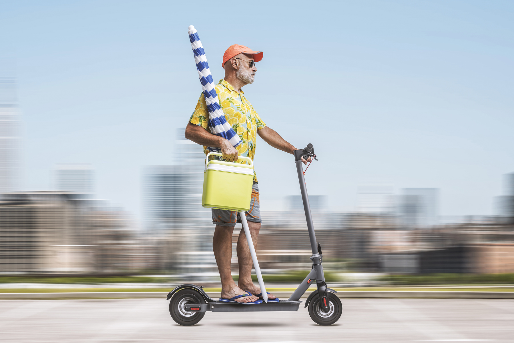 mp64128718-senior-man-on-scooter-going-to-the-beach.jpg