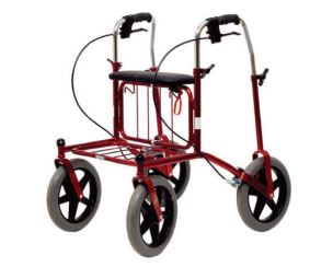 Mörkröd fyrhjulig rollator, stora hjul. Bakåtvända handtag med handbromsar, extra stag ner till hjul. Sittplatta. 